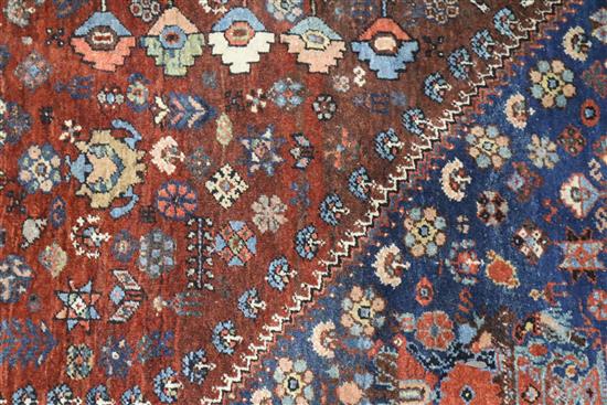 A Persian blue ground carpet 215cm x 155cm